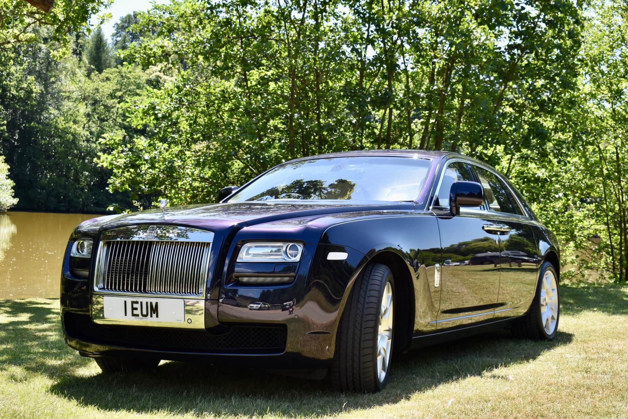 Rolls Royce Ghost Dark blue with sun shining on paintwork