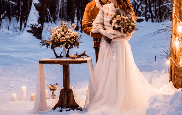 bride and groom in the snow