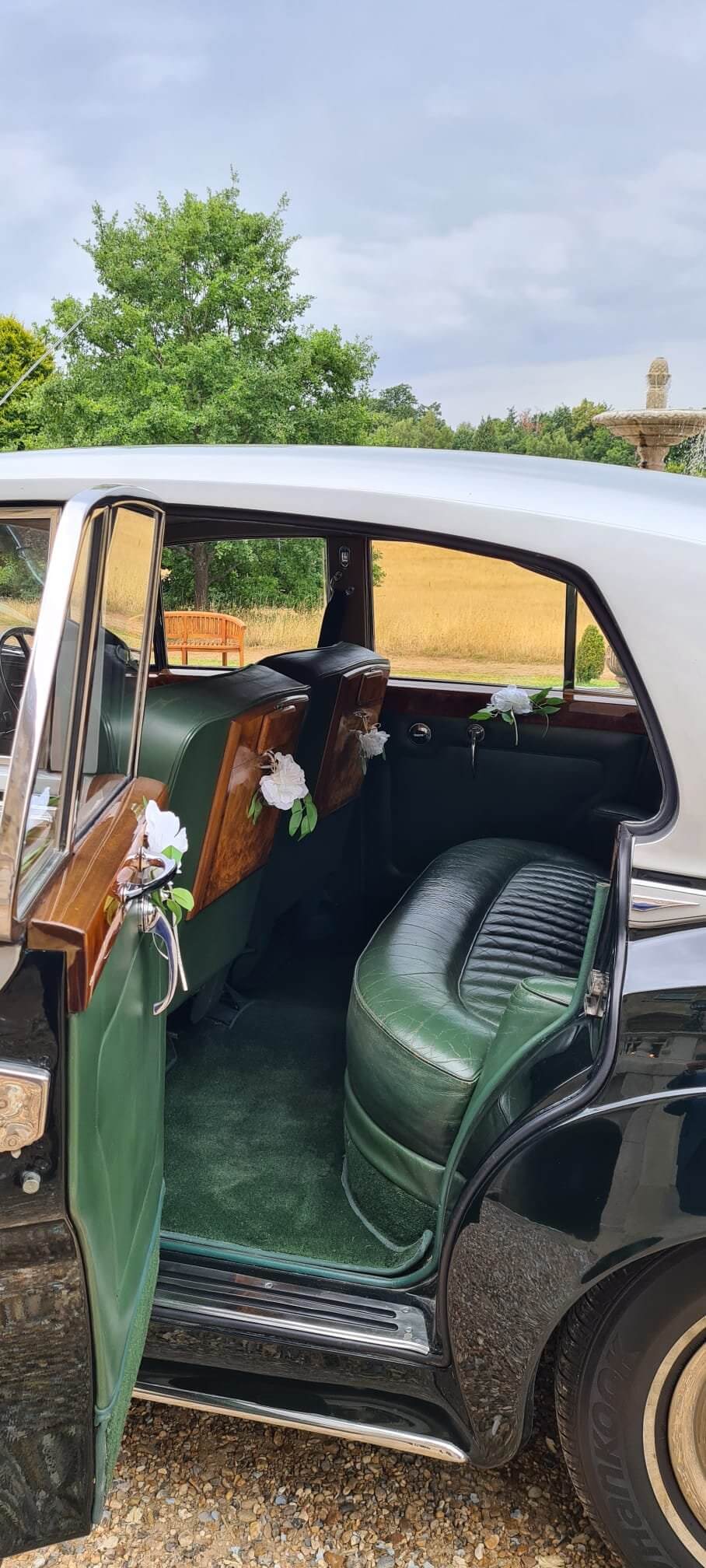 luxury car with green leather seats and flower decorations