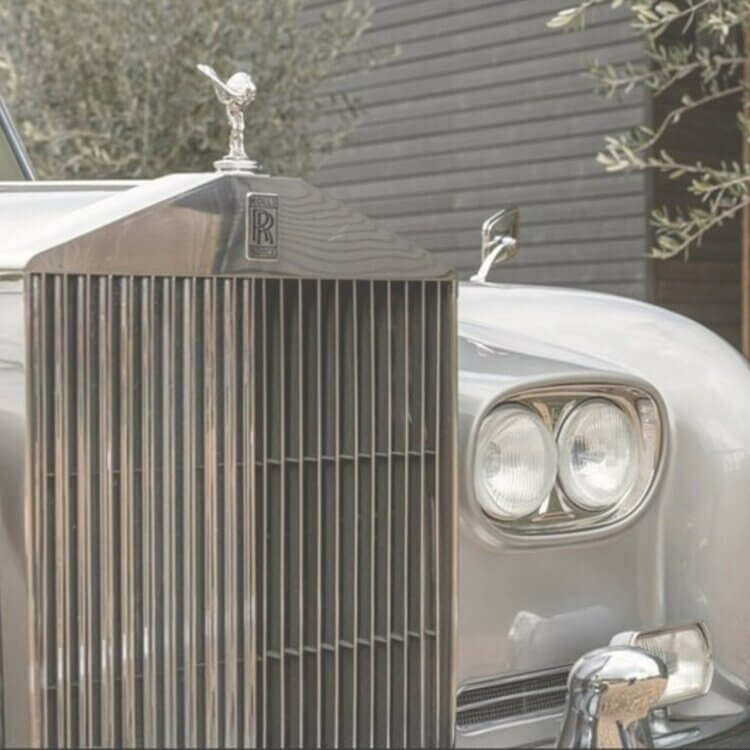 close up of rolls royce grille and spirit of ecstacy on top