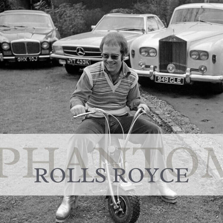 elton john on small bike black and white